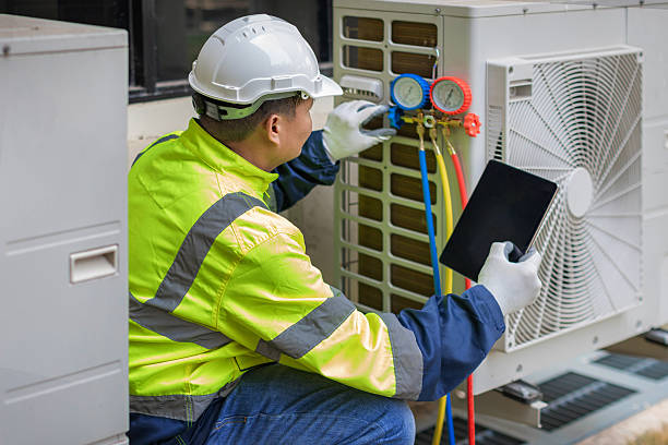 Professional Hvac technician working in Elkmont, AL